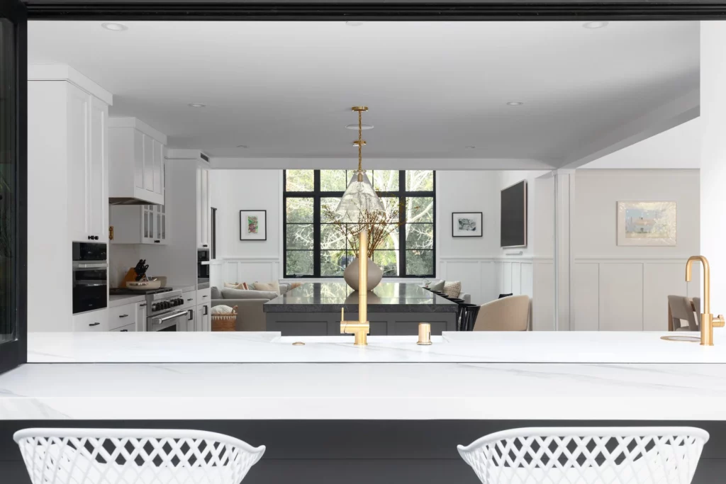 Modern kitchen remodel with white cabinets and granite countertops in progress
